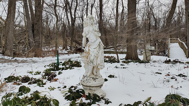 Statue nestled in snowy area